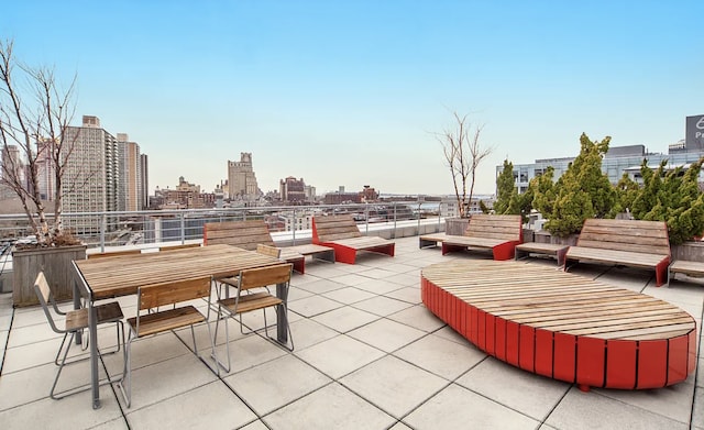 view of patio / terrace with a skyline view and outdoor dining space