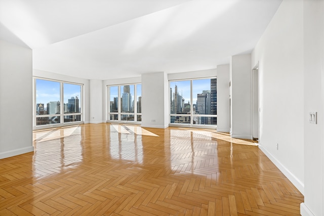 845 United Nations Plz Unit 52C, New York City, NY 10017 - spare room with a skyline view and baseboards