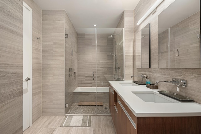 337 E 62nd St Unit Twnhse1A, New York City, NY 10065 - bathroom featuring double vanity and a stall shower