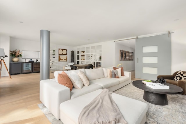 living room featuring light wood finished floors and wine cooler