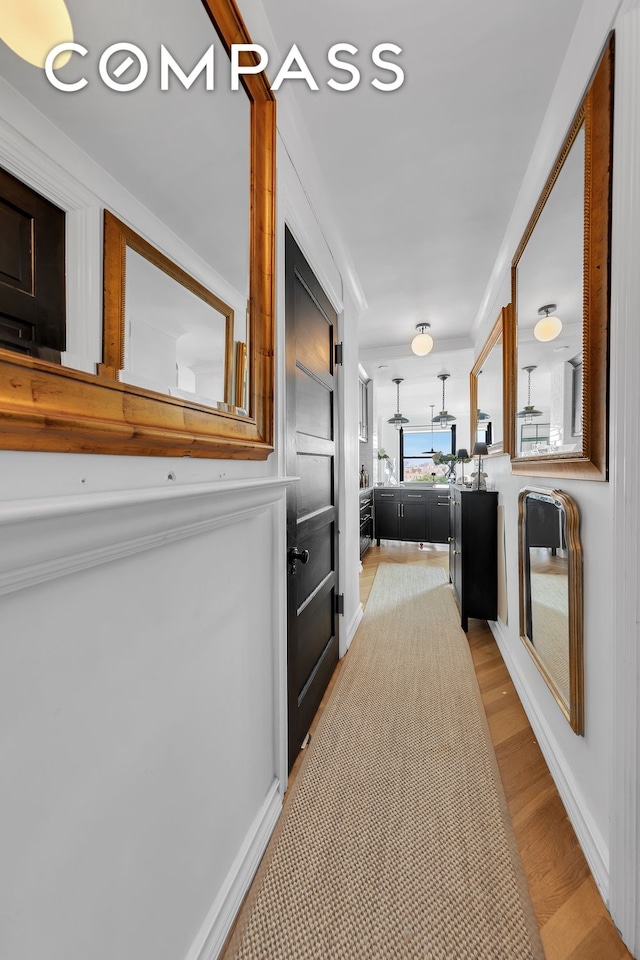 hallway with light wood-type flooring
