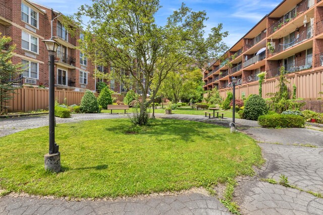 308 101st St Unit 44C, New York City, NY 11209 - view of property's community featuring a yard