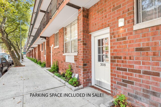 308 101st St Unit 44C, New York City, NY 11209 - view of exterior entry featuring brick siding