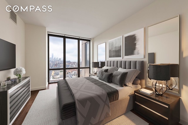 bedroom featuring dark wood-style flooring, a wall of windows, and visible vents