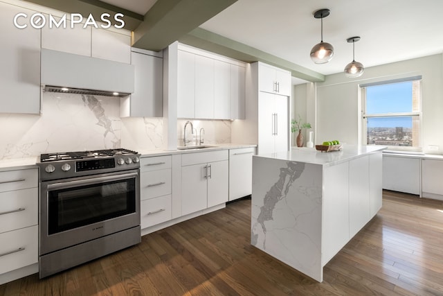 kitchen with gas stove, a sink, custom range hood, white dishwasher, and decorative backsplash