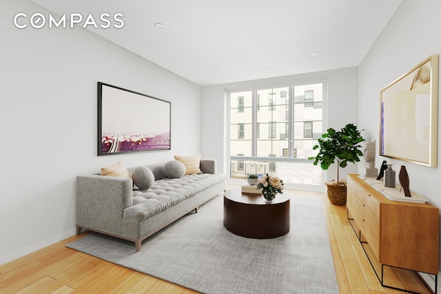 40 Schaefer St Unit 3R, New York City, NY 11207 - living area featuring baseboards and light wood-type flooring