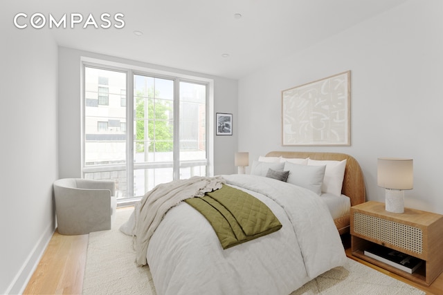 40 Schaefer St Unit 3R, New York City, NY 11207 - bedroom with baseboards and wood finished floors