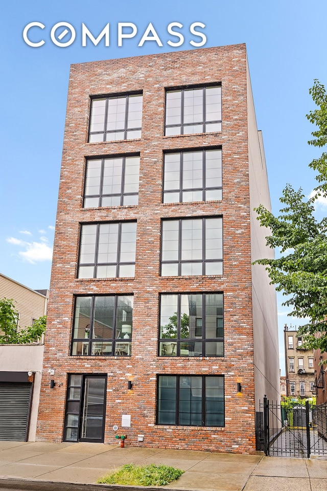 40 Schaefer St Unit 3R, New York City, NY 11207 - view of property featuring fence