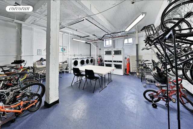 dining area with stacked washer / dryer and washer and dryer