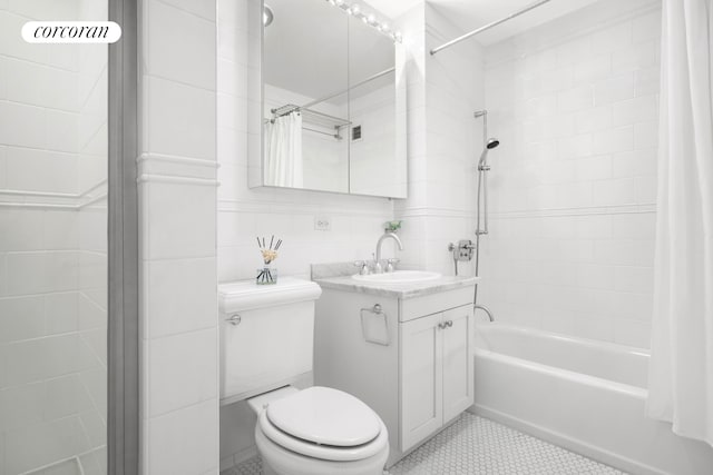 425 5th Ave Unit 22F, New York City, NY 10016 - full bath with vanity, shower / tub combo, tile patterned floors, and tile walls