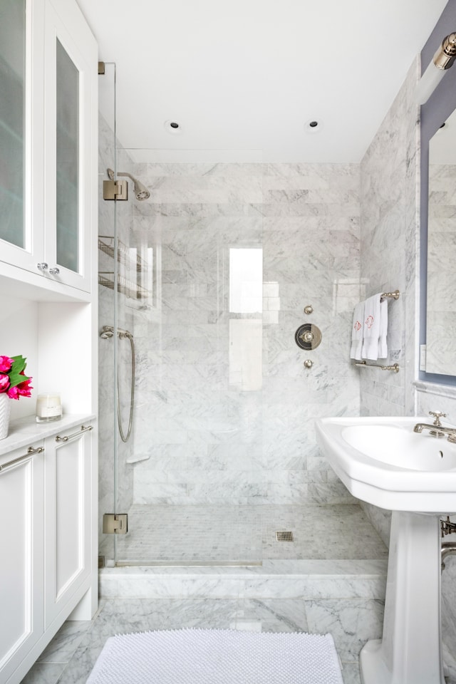 114 E 84th St Unit 8B, New York City, NY 10028 - bathroom featuring a marble finish shower and marble finish floor