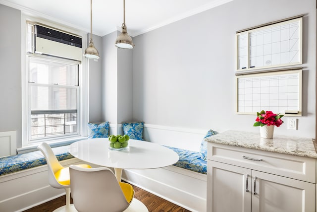 114 E 84th St Unit 8B, New York City, NY 10028 - dining room with breakfast area, an AC wall unit, crown molding, and dark wood finished floors