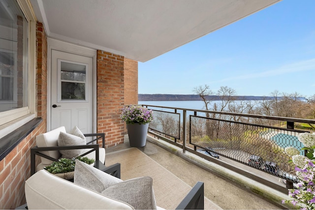 balcony featuring a water view