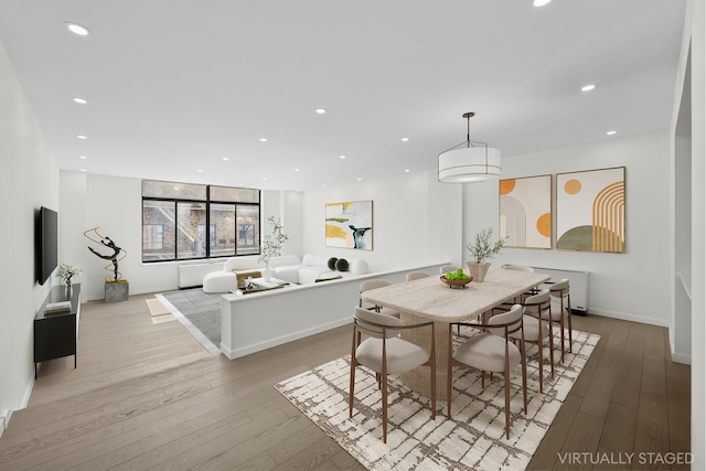 dining space with recessed lighting, baseboards, and light wood-style floors