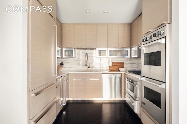 400 W 12th St Unit 4J, New York City, NY 10014 - kitchen with a sink, light countertops, decorative backsplash, and stainless steel appliances