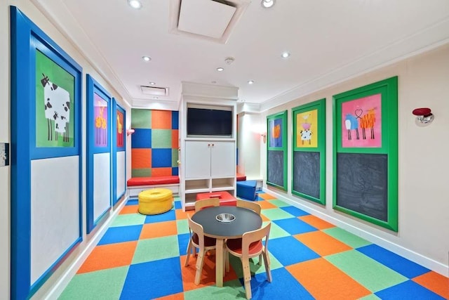 rec room featuring tile patterned floors, recessed lighting, ornamental molding, and baseboards