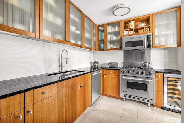 kitchen with tasteful backsplash, beverage cooler, stainless steel appliances, and a sink