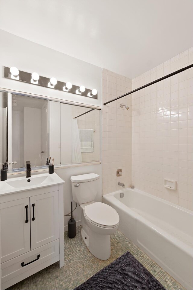 5 E 22nd St Unit 9R, New York City, NY 10010 - full bath featuring shower / bath combo, tile patterned floors, toilet, and vanity