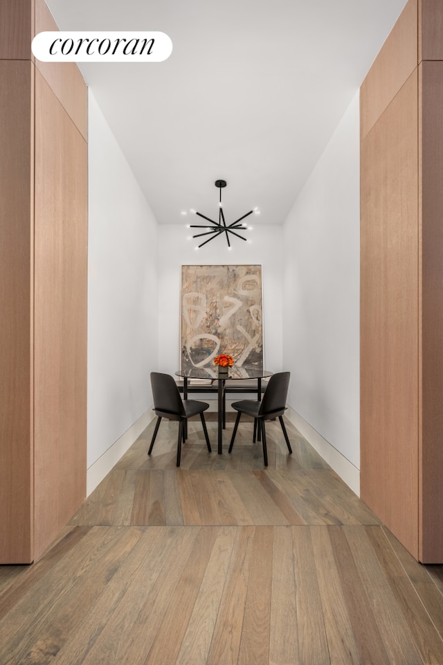 dining room featuring a chandelier and wood finished floors