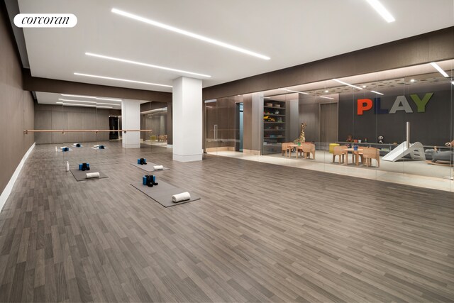 49 Chambers St Unit 5D, New York City, NY 10007 - exercise room featuring baseboards and wood finished floors