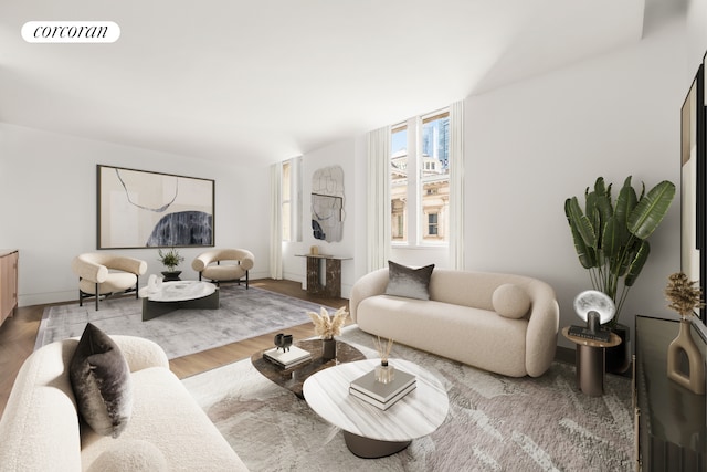 living room featuring visible vents, baseboards, and wood finished floors