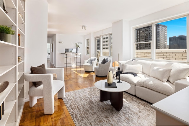 living area featuring a city view and plenty of natural light