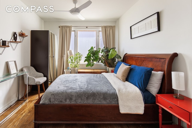 bedroom with a ceiling fan and wood finished floors