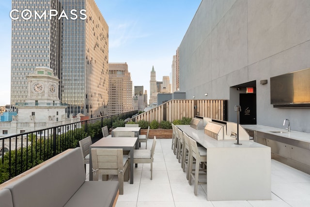 view of patio / terrace with a bar and area for grilling