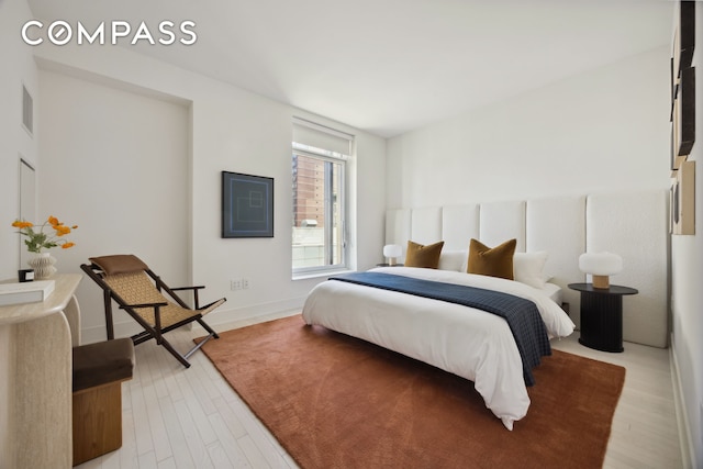 bedroom with light wood-type flooring