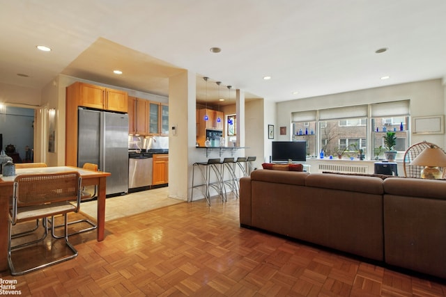 3850 Hudson Manor Ter Unit 1Ee/2Ee, New York City, NY 10463 - living room with recessed lighting and radiator heating unit