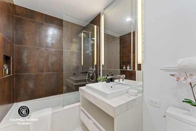 133 W 22nd St Unit 5J, New York City, NY 10011 - full bath featuring toilet, vanity, and bath / shower combo with glass door