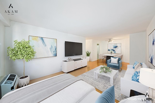579 W 215th St Unit 5-D, New York City, NY 10034 - living room featuring light wood finished floors and a ceiling fan