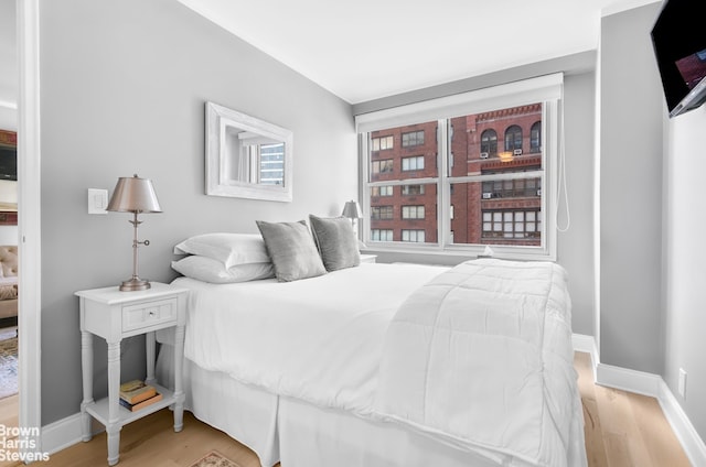 520 E 72nd St Unit 9C, New York City, NY 10021 - bedroom with light wood finished floors and baseboards