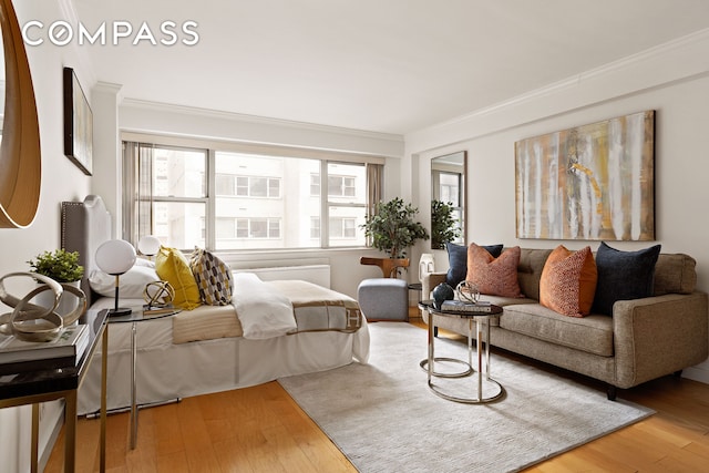 330 E 49th St Unit 9C, New York City, NY 10017 - living room featuring hardwood / wood-style flooring and crown molding