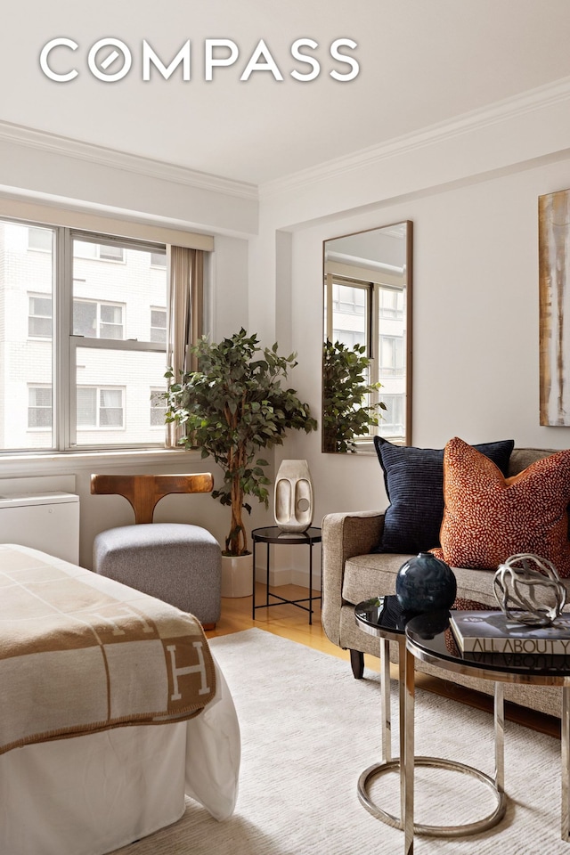 330 E 49th St Unit 9C, New York City, NY 10017 - living room with crown molding, healthy amount of natural light, and wood finished floors