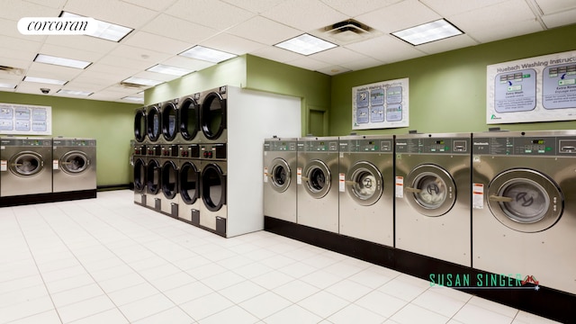 405 W 23rd St Unit 14F, New York City, NY 10011 - community laundry room featuring visible vents and washing machine and dryer