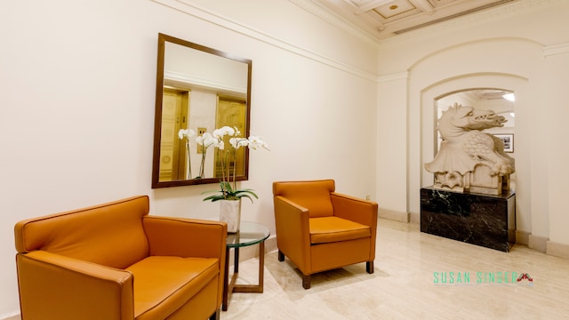 405 W 23rd St Unit 14F, New York City, NY 10011 - living area featuring crown molding, arched walkways, and baseboards