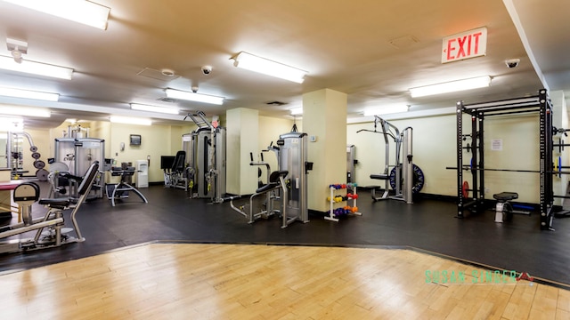 405 W 23rd St Unit 14F, New York City, NY 10011 - workout area featuring wood finished floors