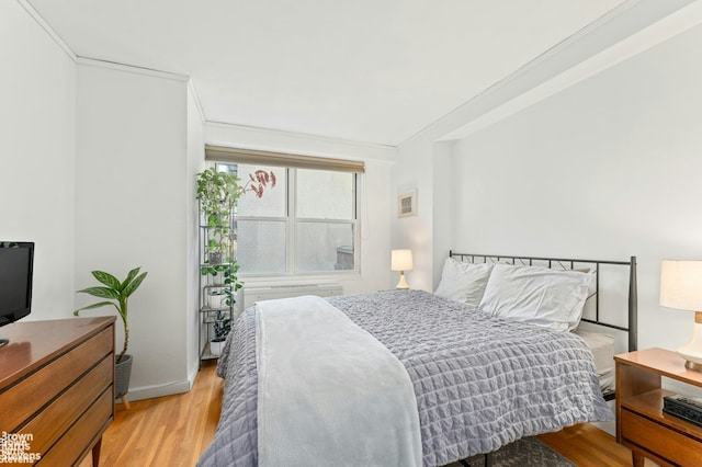 bedroom featuring light wood-style floors