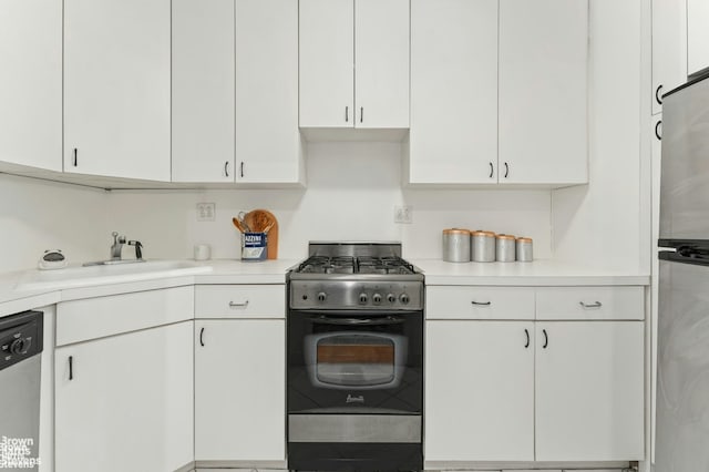 kitchen featuring light countertops, white cabinetry, and appliances with stainless steel finishes