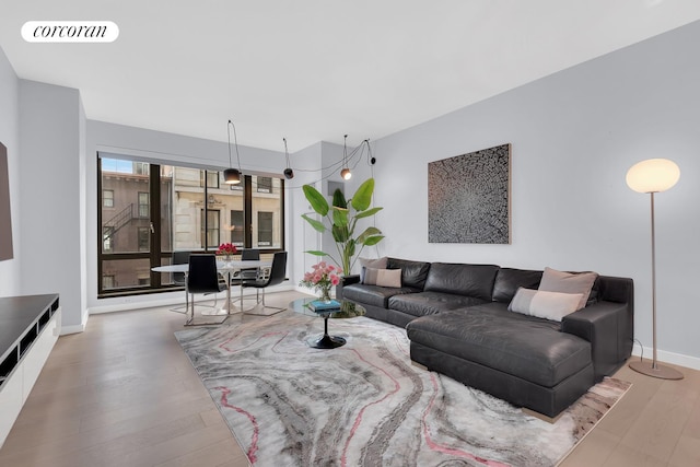 4 W 21st St Unit 4B, New York City, NY 10010 - living area with wood finished floors and baseboards