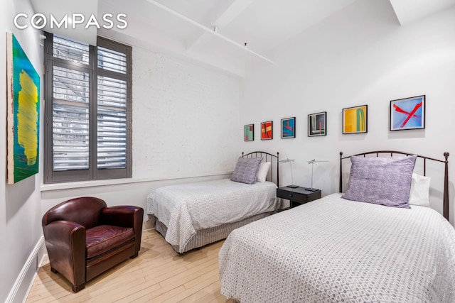 bedroom featuring wood finished floors