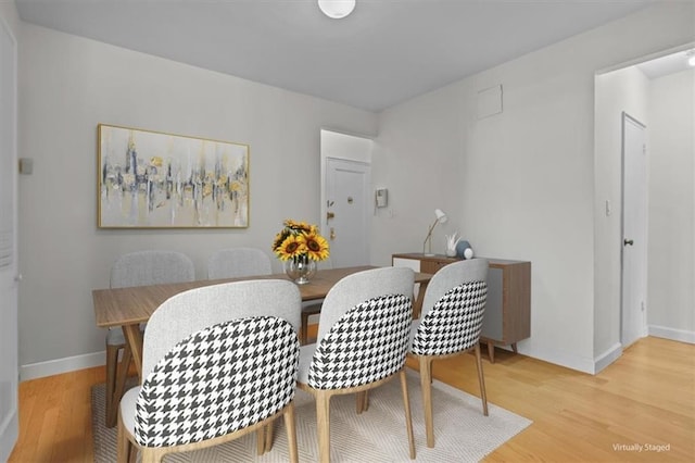 620 W 239th St Unit 6B, New York City, NY 10463 - dining space featuring light wood-style flooring and baseboards