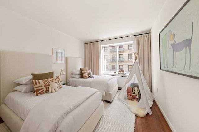 603 W 148th St Unit 3A, New York City, NY 10031 - bedroom featuring wood finished floors and baseboards