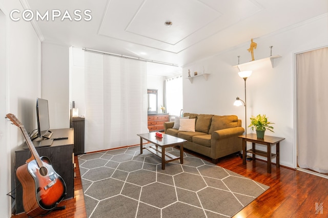 living room featuring crown molding and wood finished floors