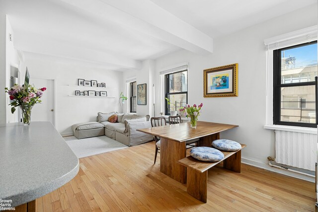 2166 Broadway Unit 16F, New York City, NY 10024 - dining room with light wood-type flooring, plenty of natural light, and beamed ceiling