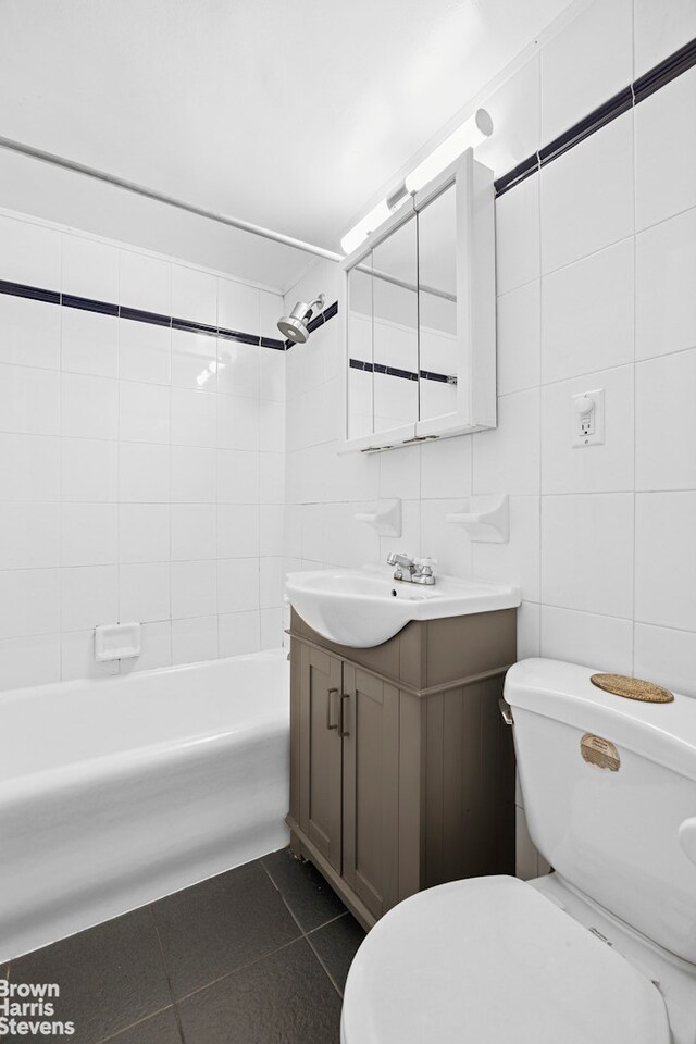 2166 Broadway Unit 16F, New York City, NY 10024 - bathroom featuring vanity, tile patterned flooring, tile walls, and shower / bath combination