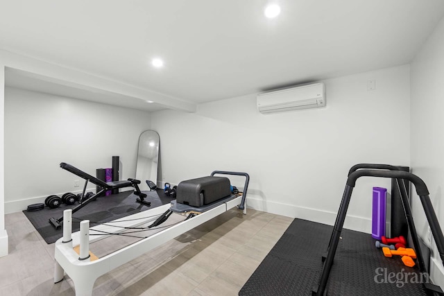 exercise area featuring recessed lighting, a wall mounted AC, and baseboards