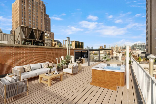 55 Walker St Ph, Ph, New York City, NY 10013 - deck with an outdoor hangout area, a hot tub, and a city view