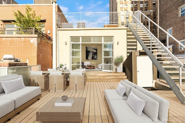 55 Walker St Ph, Ph, New York City, NY 10013 - wooden deck featuring stairway, outdoor dining area, and an outdoor hangout area